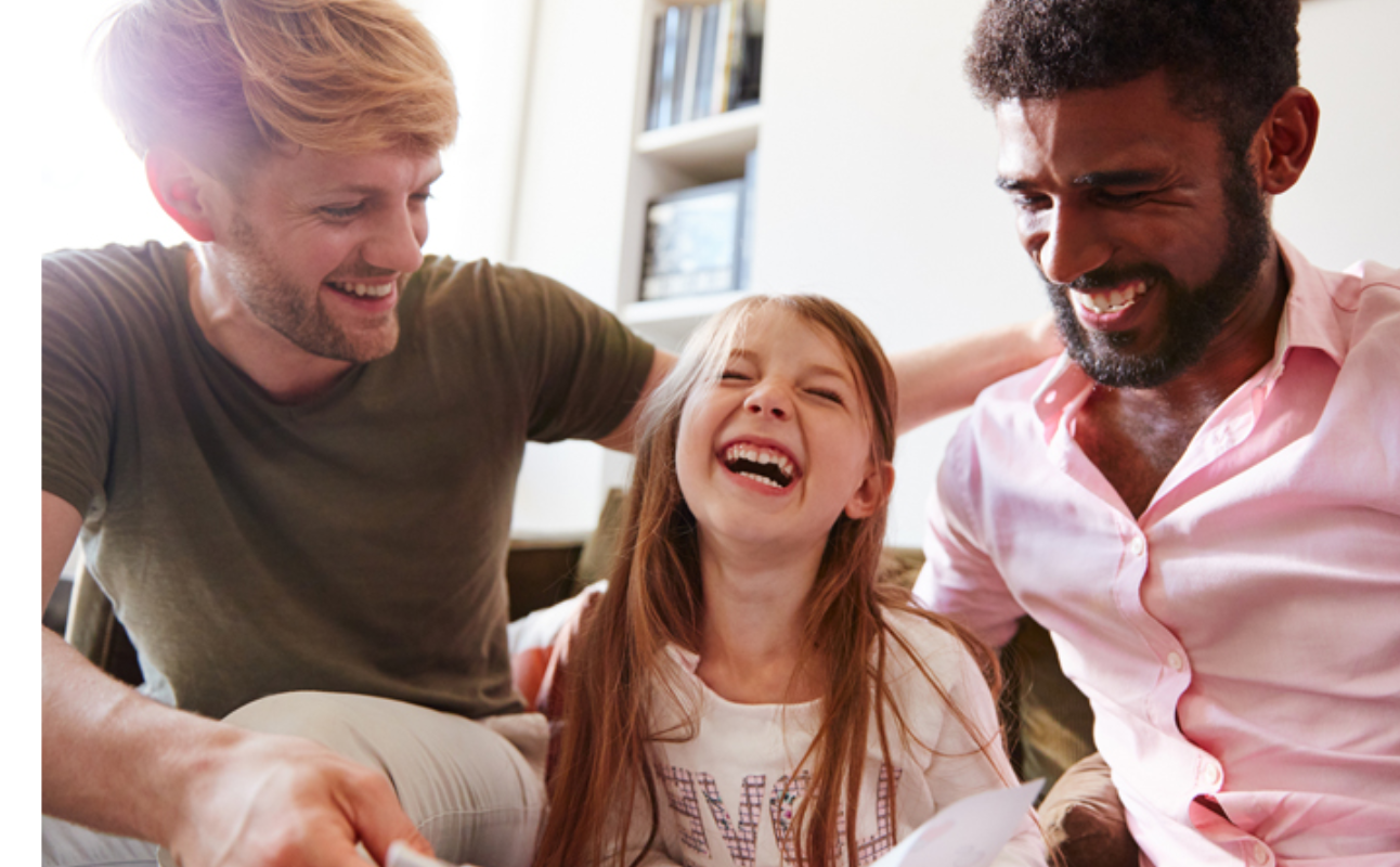 Adoptive LGTBQ couple with their daughter